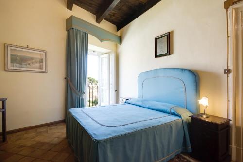 Castello Di Caccuri Suites 객실 침대