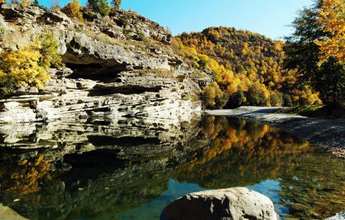 a river with a rock in the water at Guesthouse Alexandros in Nestorio
