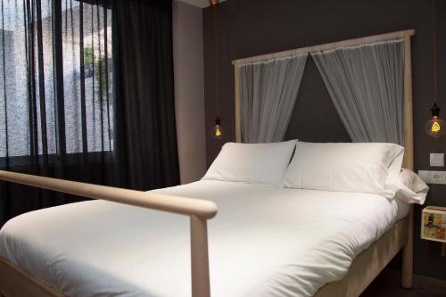 Cama ou camas em um quarto em Kasa Kata