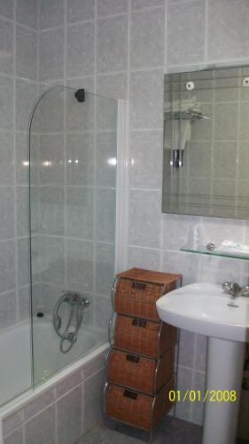 a bathroom with a tub and a sink and a shower at Virgen del Mar Holidays in Mojácar