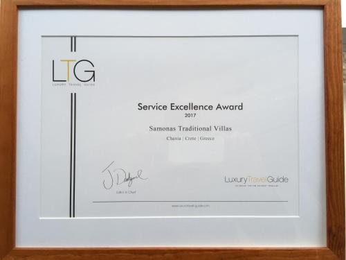 a framed picture of a certificate in a picture frame at Samonas Traditional Villas in Samonás
