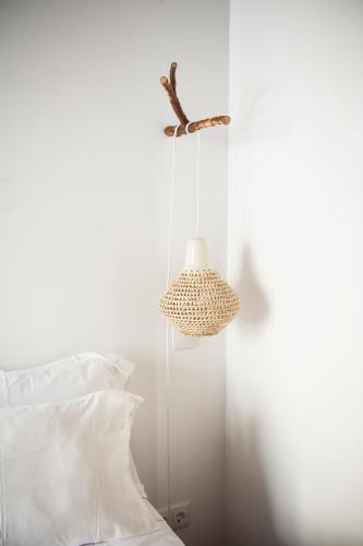 a bedroom with a bed and a bird on the wall at Lemon Tree Stay in Faro