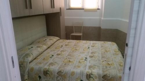 Flaviogioia Apartmentにあるベッド