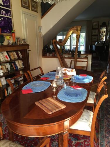 a dining room table with blue plates on it at Apartment Whenlifeisbetter in Casal Palocco