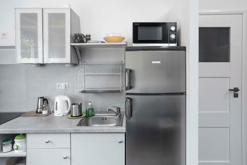 Green House - Two Bedroom Apartment tesisinde mutfak veya mini mutfak