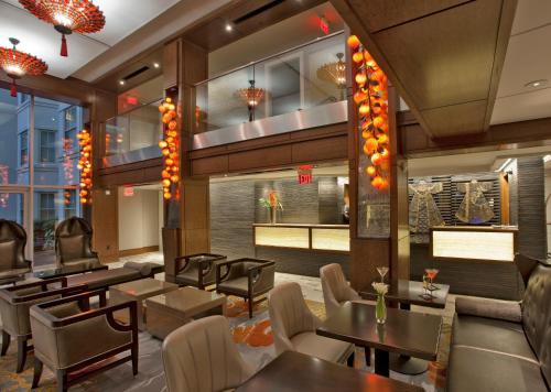 a restaurant with tables and chairs and lights at Morrison Clark Inn Washington DC Convention Center in Washington