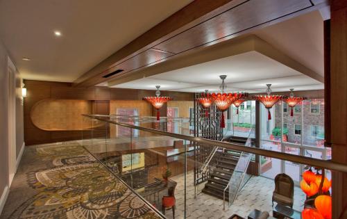 a glass staircase in a building with chandeliers at Morrison Clark Inn Washington DC Convention Center in Washington