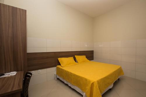 Ένα ή περισσότερα κρεβάτια σε δωμάτιο στο Recanto Hotel Clube