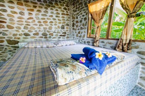 Ένα ή περισσότερα κρεβάτια σε δωμάτιο στο Rattana Bungalow Koh Chang