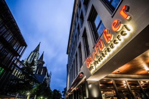 a neon sign on the side of a building at RiKu HOTEL Ulm in Ulm