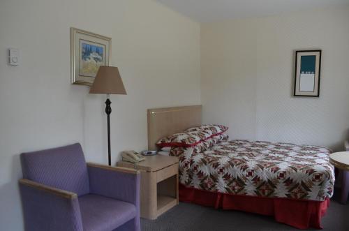 Ένα ή περισσότερα κρεβάτια σε δωμάτιο στο Seaside Villa Motel & RV Park