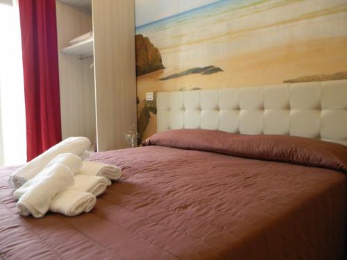 Una cama o camas en una habitación de Tropeacentro