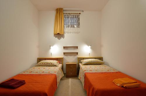 Posteľ alebo postele v izbe v ubytovaní villa Maya