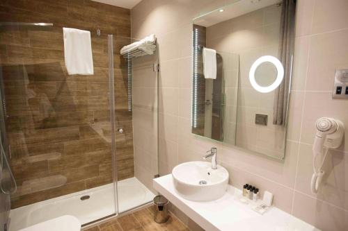 a bathroom with a sink and a shower at Palazzo Paolina Boutique Hotel in Valletta