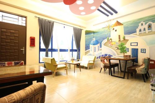 a living room with a painting on the wall at Harbourview in Taitung City