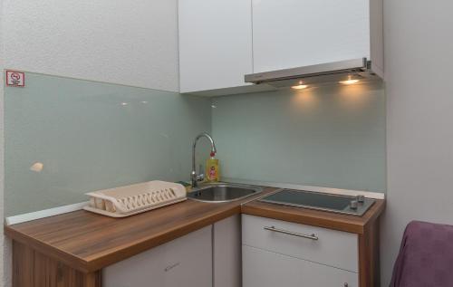a small kitchen with a sink and a sink at Villa Marija in Trogir