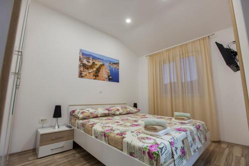 Cama ou camas em um quarto em Apartment Dalmatia