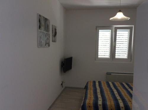 Postel nebo postele na pokoji v ubytování Apartments Maja