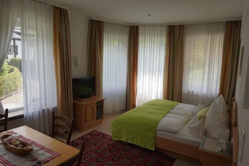 Ένα ή περισσότερα κρεβάτια σε δωμάτιο στο Hotel Garni Liberia