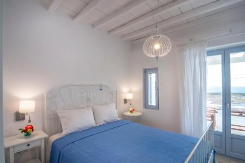 Ένα ή περισσότερα κρεβάτια σε δωμάτιο στο Passos Villas