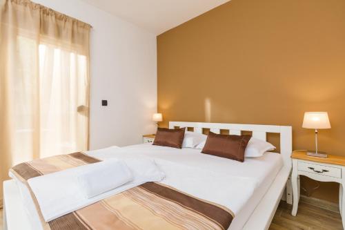 Cama o camas de una habitación en Apartments 26