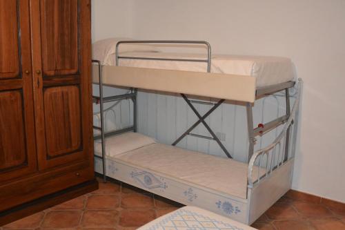 a bunk bed room with two bunk beds in a room at Turismo Rurale Belvedere Pradonos in Dorgali