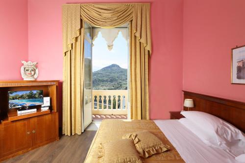 Posteľ alebo postele v izbe v ubytovaní Excelsior Palace Hotel