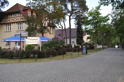 a cobblestone street in front of a building at Hotel & Restaurant Raueneck in Bad Saarow