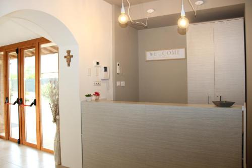 a kitchen with a counter with a cross on the wall at Valle Di Francesco in Assisi