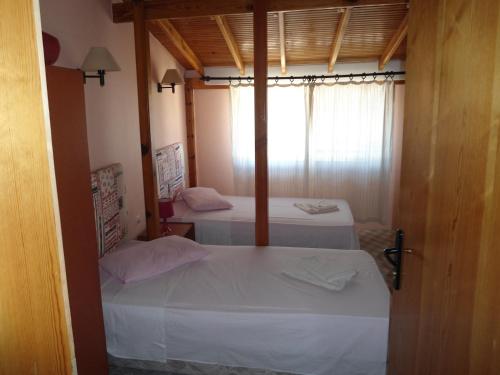 Katil atau katil-katil dalam bilik di Teras Motel