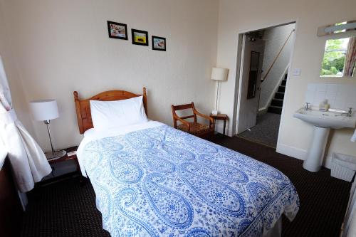 Katil atau katil-katil dalam bilik di Talisker Guest House