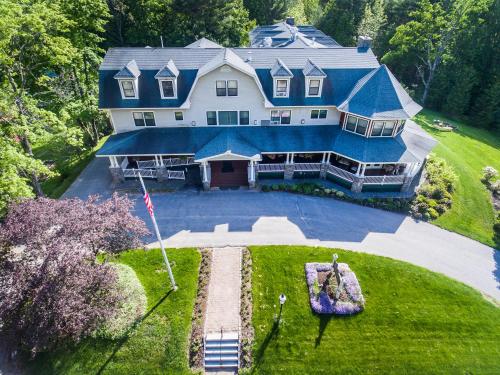 an aerial view of a large house with a blue roof at The Inn at Thorn Hill in Jackson