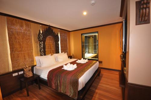 En eller flere senge i et værelse på Chalelarn Hotel Hua Hin
