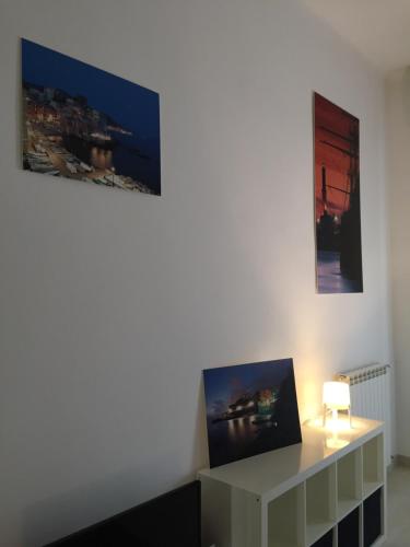 a living room with two pictures on the wall at Sea Loft in Genova