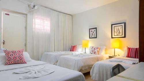 A bed or beds in a room at Pousada e Hostel São Paulo Econômica