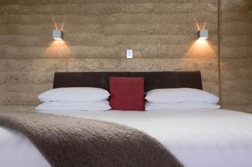 Łóżko lub łóżka w pokoju w obiekcie Eagle Peaks at Freycinet