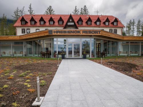 a large building with a sign that reads interview resort at Apartmán Cyril A 104 in Smokovce