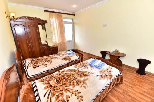 Postel nebo postele na pokoji v ubytování Haghpat Hotel