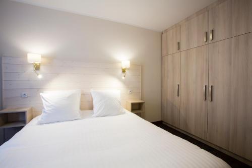 Postel nebo postele na pokoji v ubytování Laterale Residences Riquewihr