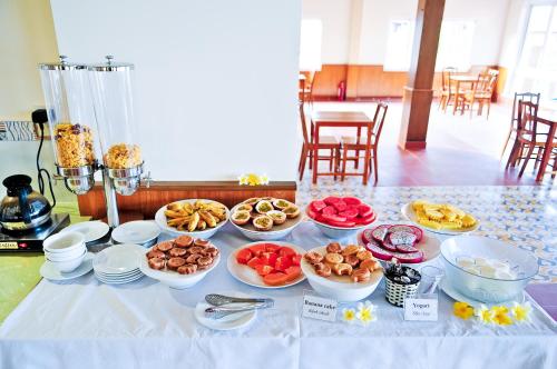 a table with many plates of food on it at Sea Star Resort in Phu Quoc