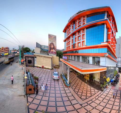 an overhead view of a building on a city street at Hotel Benzz Park Vellore in Vellore