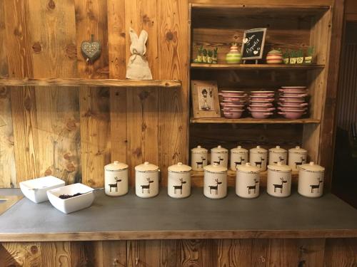 a shelf with a bunch of knick knacks on a table at Hotel Ehrwalderhof in Ehrwald