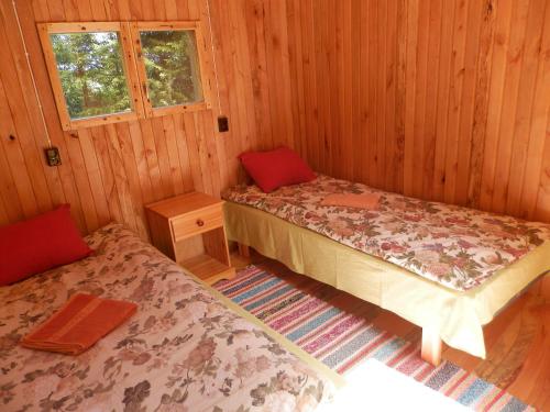 Un pat sau paturi într-o cameră la Ala-Laugu Holiday Home