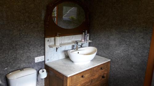 a bathroom with a sink and a mirror at Vilnius Luxury Apartment 1 in Vilnius
