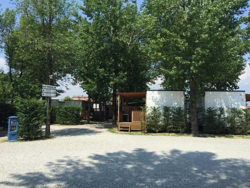 a building with trees and a sign in front of it at Camping Venezia Village in Mestre