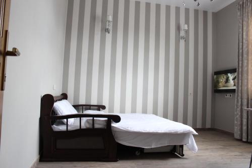 Ένα ή περισσότερα κρεβάτια σε δωμάτιο στο Hotel Barin House