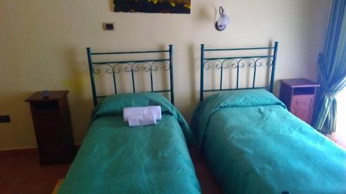 Letto o letti in una camera di B&B Le Stanze del Sogno