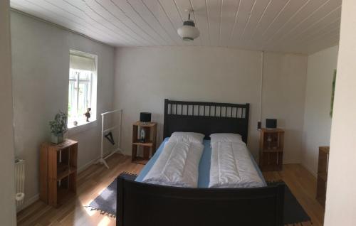 Postel nebo postele na pokoji v ubytování Skovhuset