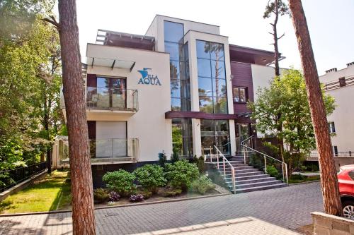 a building with the akvation logo on it at Villa Aqua BlueApart Jurata in Jurata