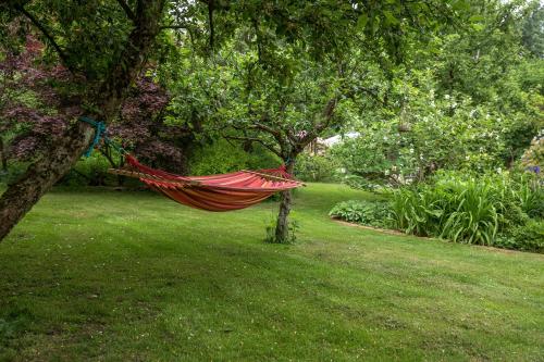 a hammock hanging from a tree in a garden at Bed & Breakfast Horsens in Horsens